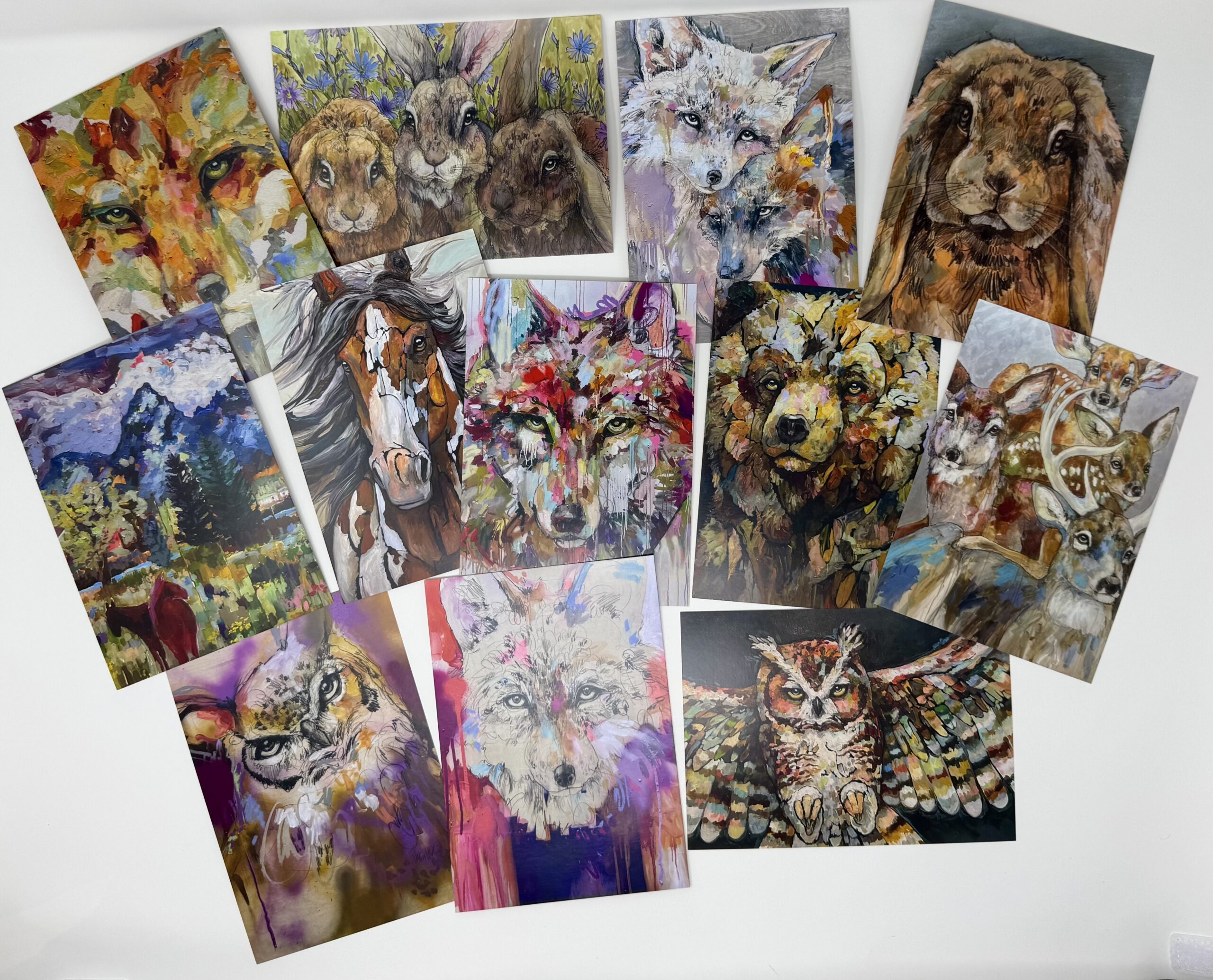 Colorful animal paintings arranged on white background