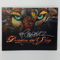The cover of the DREAMERS DON'T SLEEP BOOK with an image of a tiger.
