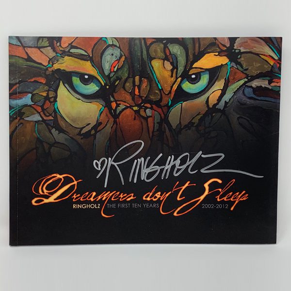 The cover of the DREAMERS DON'T SLEEP BOOK with an image of a tiger.