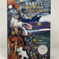 Book cover featuring rabbits and whimsical art.