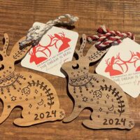 Two decorative wooden rabbits for 2024.