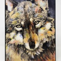 Colorful painting of a wolf's face.