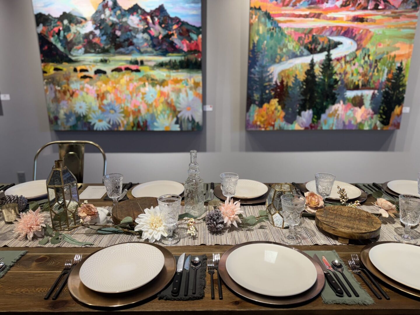 Elegantly set dining table with floral centerpiece