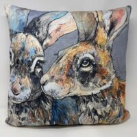 Decorative pillow featuring two illustrated rabbits