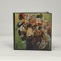 Colorful painted wolf portrait in black frame